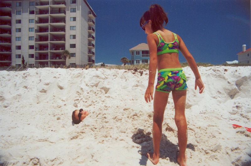 fl-2000---lindsey-looking-at-jeremy-buried-in-sand.jpg