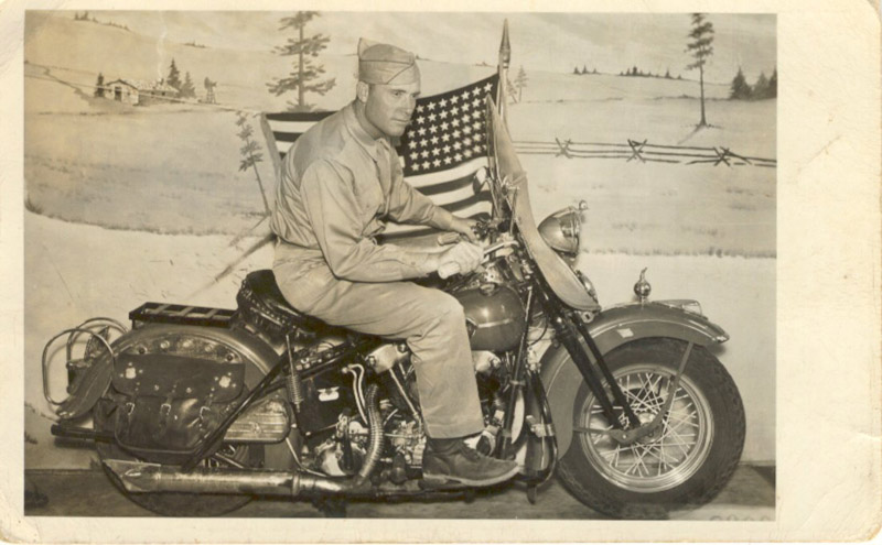 elbrey-postcard,-riding-a-harley-davidson,-(c)-1944.jpg
